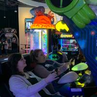 Two alumni playing Sega Amusements